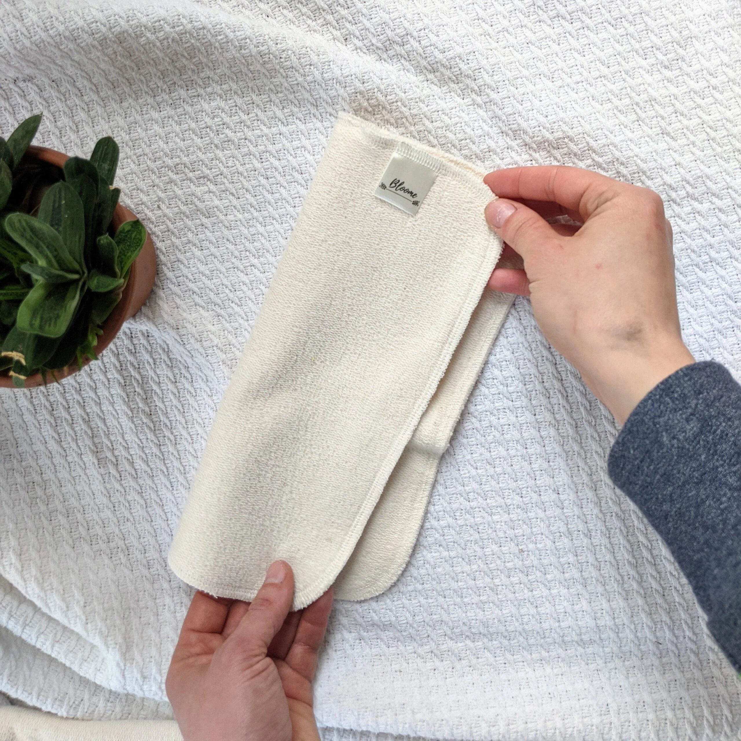 Booster bifold in tessuto naturale Bloome