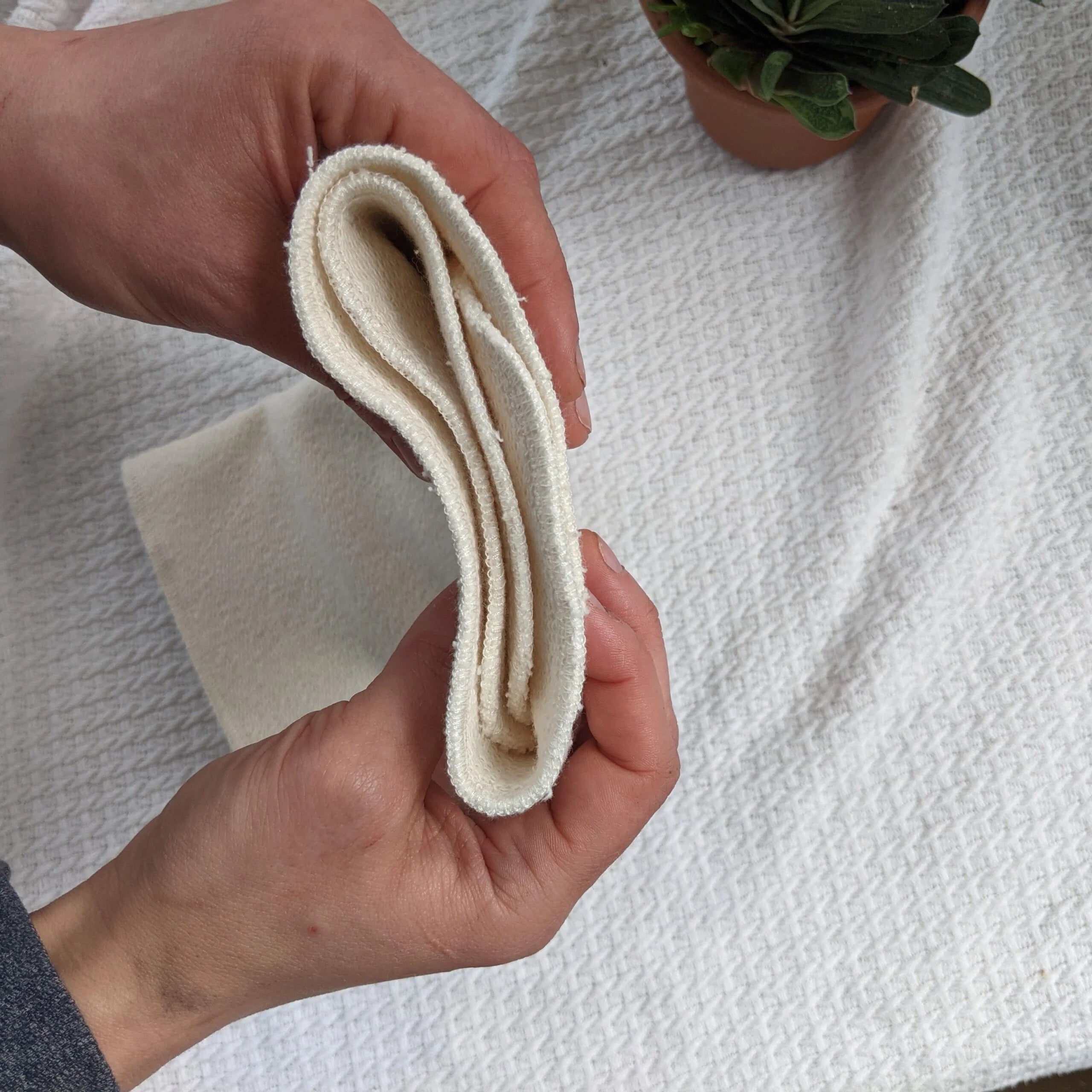 Booster bifold in tessuto naturale Bloome
