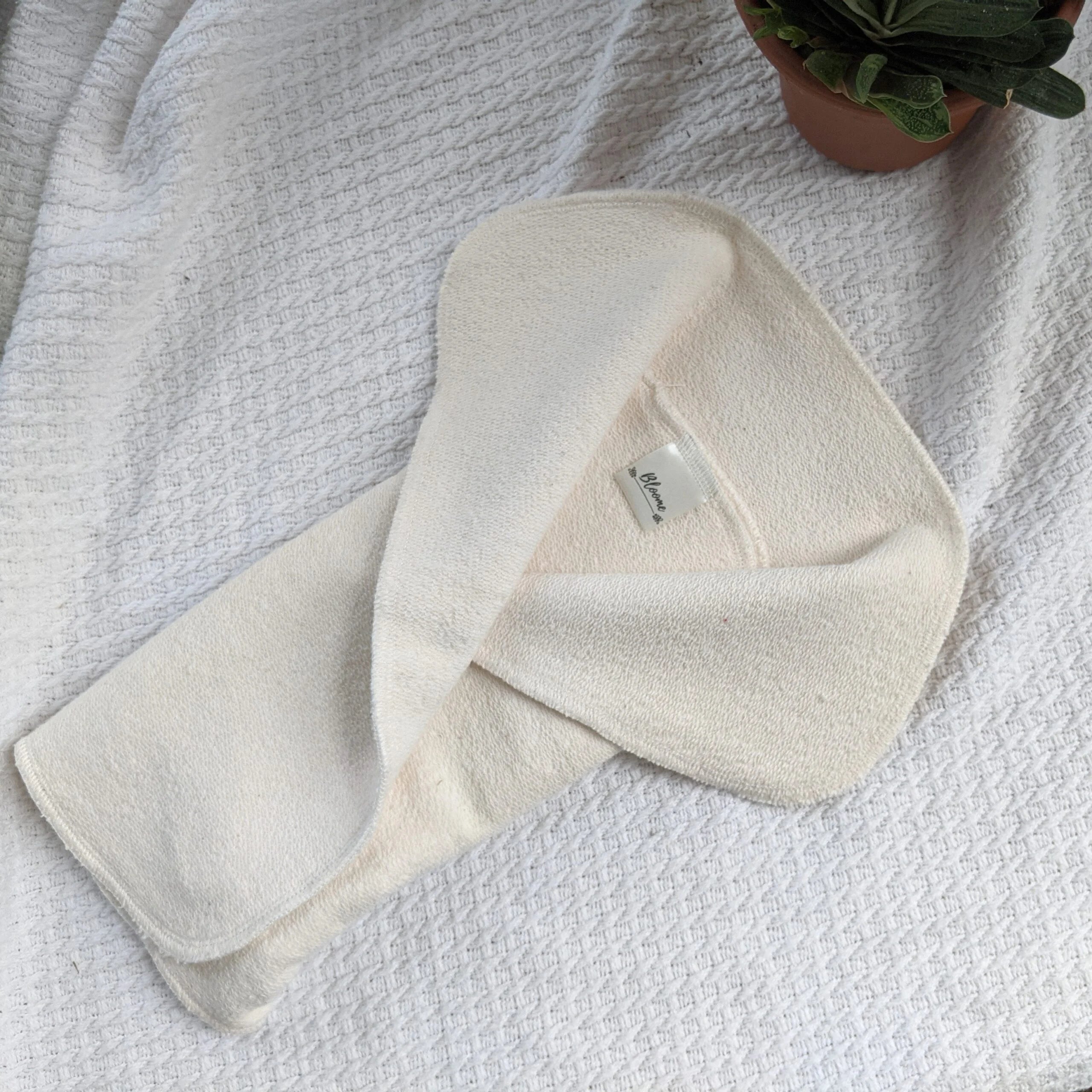 Booster bifold in tessuto naturale Bloome