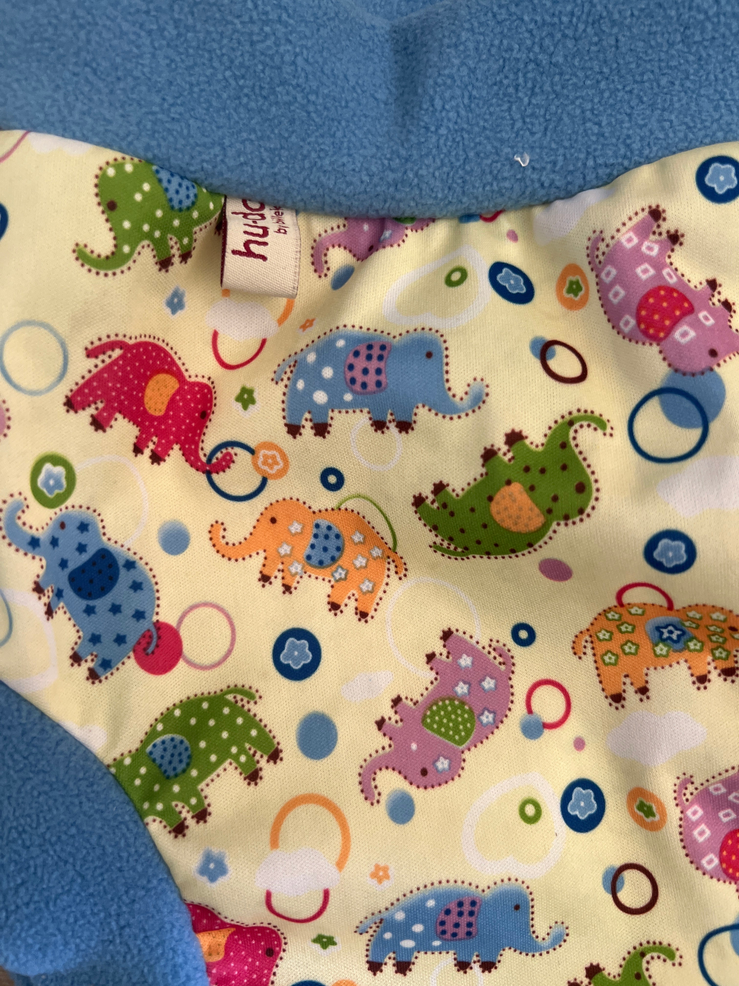 Cover in PUL con bordini in pile Huda